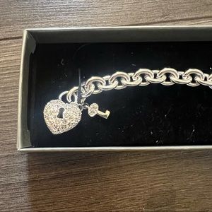 Silver chain bracelet with crystal heart lock and key